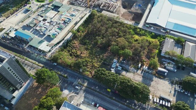 Tilt-up Reveal Of Building Site In City Of Las Piñas In Metro Manila, Philippines. aerial shot
