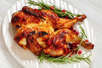 butterflied, spatchcock roast chicken on a plate