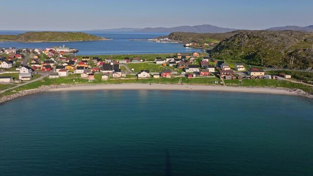Aerial tracking shot in front of the Vestersanden beach, summer in Pykeija, Norway