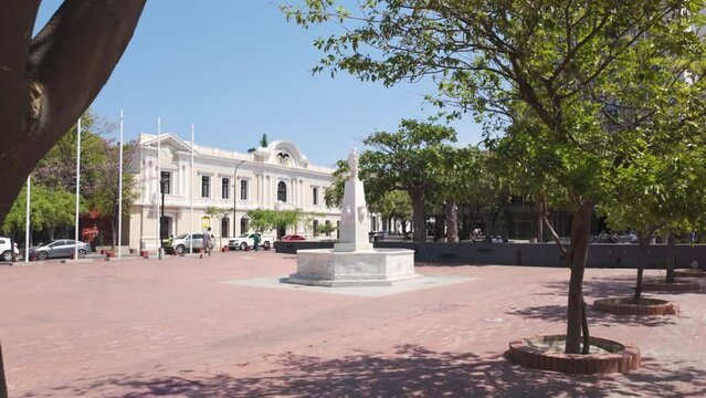 Establishing shot of Bolivar Park, red tiled famous square in Santa Marta City, Colombia