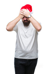 Fototapeta premium Young caucasian hipster man wearing christmas hat over isolated background suffering from headache desperate and stressed because pain and migraine. Hands on head.