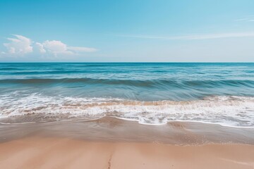 Fototapeta premium Serene ocean waves lapping on sandy beach