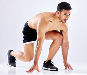 Asian man, start or runner in studio for exercise, fitness training or cardio workout on white...