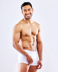 Fitness, man and happy in underwear on studio, white background or bodybuilder portrait in mockup....