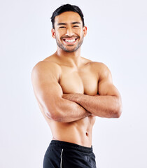 Happy asian man, portrait and muscular body with confidence for workout routine on a white studio...