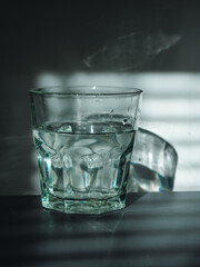GLASS OF WATER ON THE TABLE