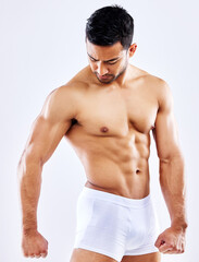 Strong, muscle and man in underwear on studio, white background or mockup of bodybuilder abdomen....