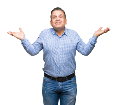 Middle age arab business man over isolated background clueless and confused expression with arms and hands raised. Doubt concept.