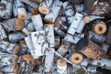 Pile of natural birch logs, background