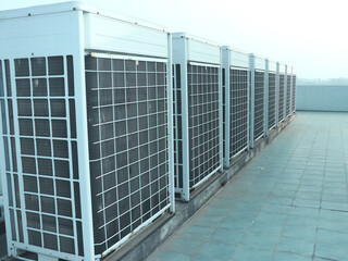 Industrial air conditioner condensers (outside unit) on the roof of a building