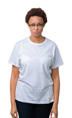 Beautiful young african american woman wearing glasses over isolated background depressed and worry for distress, crying angry and afraid. Sad expression.