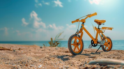 Sunshine yellow baby bike with training wheels near a beach, fun summer day,