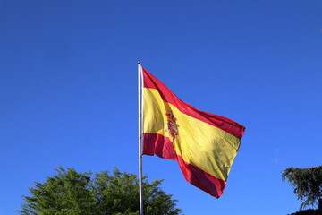 Flag of Spain over a blue sky
