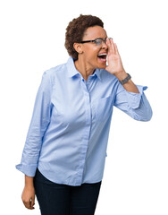 Young beautiful african american business woman over isolated background shouting and screaming loud to side with hand on mouth. Communication concept.