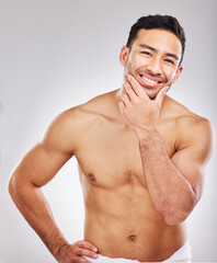 Portrait, skincare and man with cosmetics, topless and grooming routine on white studio background....
