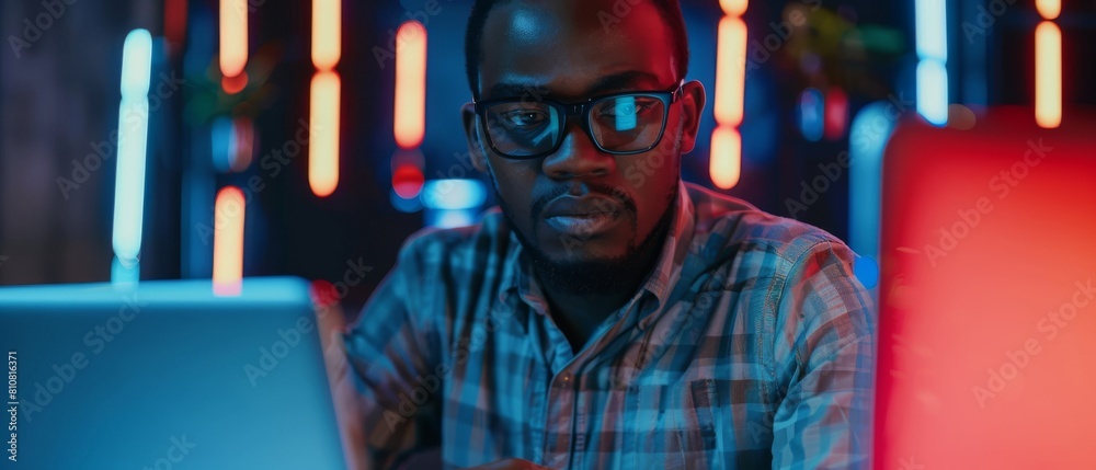Poster an agile black it programmer thinks on his laptop, finds solutions, solves problems, and brainstorms