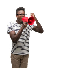 Young african american man holding megaphone annoyed and frustrated shouting with anger, crazy and yelling with raised hand, anger concept