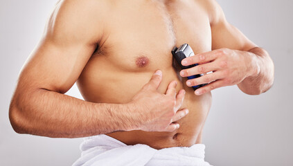 Studio, grooming and chest of man for shaving, cleaning and self care with electric equipment. Male...