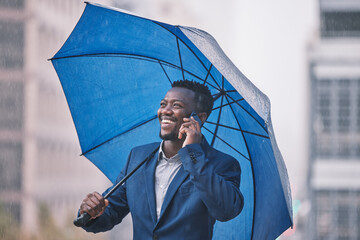 Phone call, business and black man in city, umbrella and communication with rain, smile and...