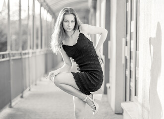 Portrait Captures Young Girl In Fashion Style Dress On Street In Black And White