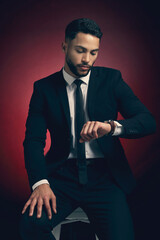 Man, fashion and studio with watch in suit, confident and elegant tuxedo with businessman for...