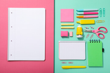 Notebook and stationery on the table, top view.