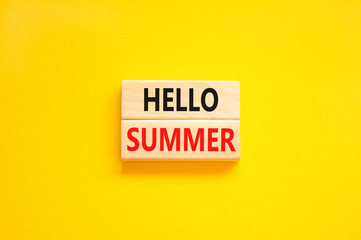 Hello summer symbol. Concept words Hello summer on beautiful wooden block. Beautiful yellow paper background. Business lifestyle Hello summer concept. Copy space.