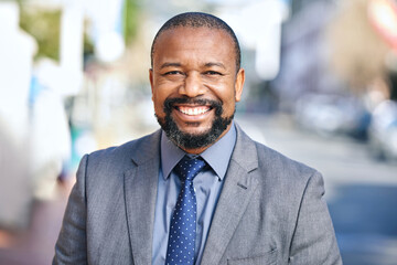 Happy, black businessman and smile for empowerment and portrait to career outside in city. Male...