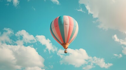 Fototapeta premium A red balloon is floating in the sky above a blue sky