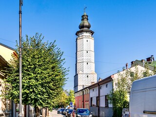 Decorated with geometric patterns, the ancient tower of the town hall, rising above the market square of the Polish city of Biecz in the Lesser Poland Voivodeship.