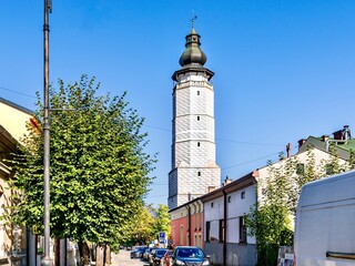 Obraz premium Decorated with geometric patterns, the ancient tower of the town hall, rising above the market square of the Polish city of Biecz in the Lesser Poland Voivodeship.