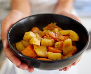 Bowl, vegetables and cooking with hands and meal prep for diet, wellness and healthy food in home. Kitchen, chef and nutrition with detox, vegan and organic side dish with lunch ready for eating