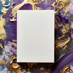 Mockup of a new book with blank white cover in modern neat style on an abstract violet and gold paint background. Square template for social media post for books and advertisement.