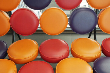 Closeup Round leather sofa - Orange Red Blue color  - Abstract Background 
