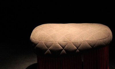 Leather chair cushions in dark light 