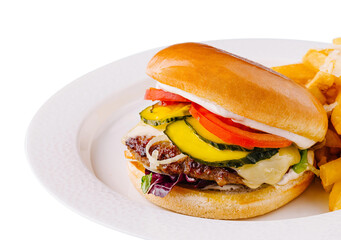 Classic cheeseburger with fries on white plate