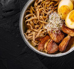 Savory ramen bowl with eggs and pork