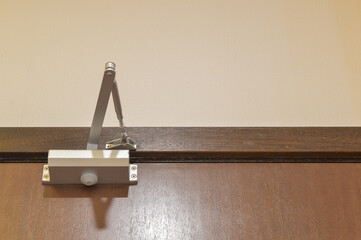 The view of the door closer or shock absorber installation showcases enhanced safety and...