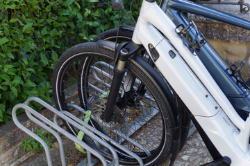 electric bicycles parked and locked with a padlock