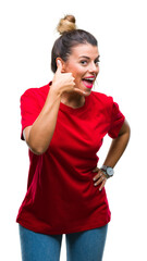 Young beautiful woman over isolated background smiling doing phone gesture with hand and fingers like talking on the telephone. Communicating concepts.