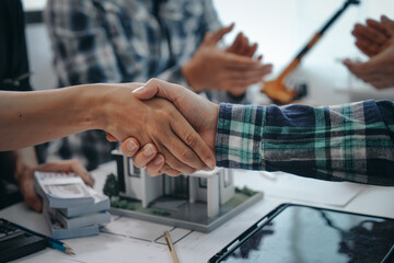 Engineers shaking hands, teamwork in meetings, drawing blueprints for condo, apartment, and house...