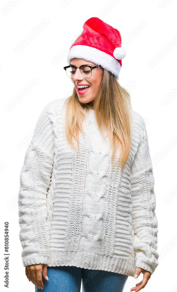 Poster Young beautiful woman wearing christmas hat over isolated background looking away to side with smile on face, natural expression. Laughing confident.