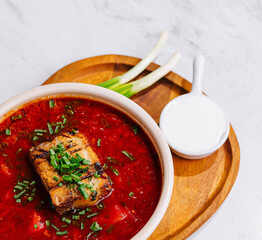 Traditional borscht soup with pork and herbs