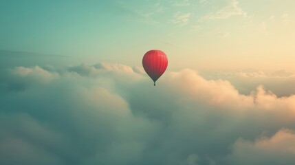 Fototapeta premium A red balloon is floating in the sky