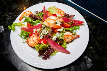 Salad with tiger shrimp, pear and greens