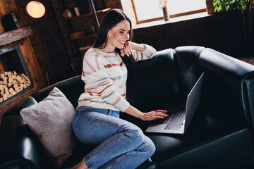 Photo of cute charming lady dressed striped sweater communicating modern device indoors house room