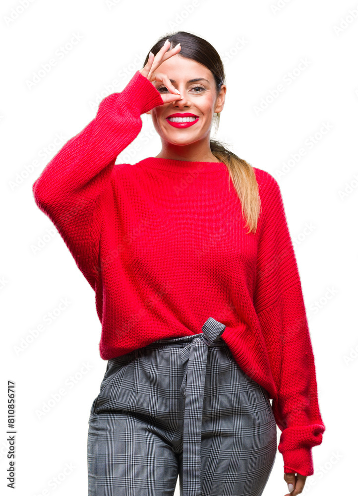 Poster Young beautiful business woman wearing winter sweater over isolated background doing ok gesture with hand smiling, eye looking through fingers with happy face.