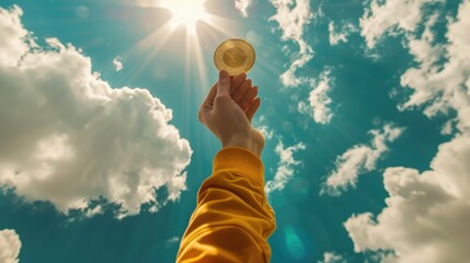 A person holding up a gold coin with the sky in the background. Suitable for financial concepts - Powered by Adobe
