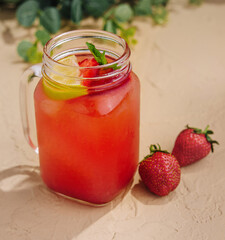 Refreshing strawberry lemonade in mason jar