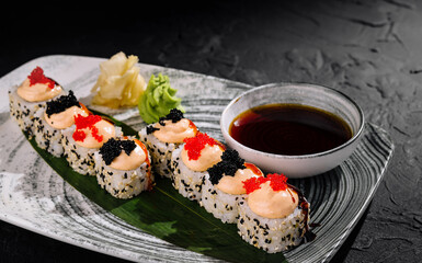 Gourmet sushi platter on slate surface